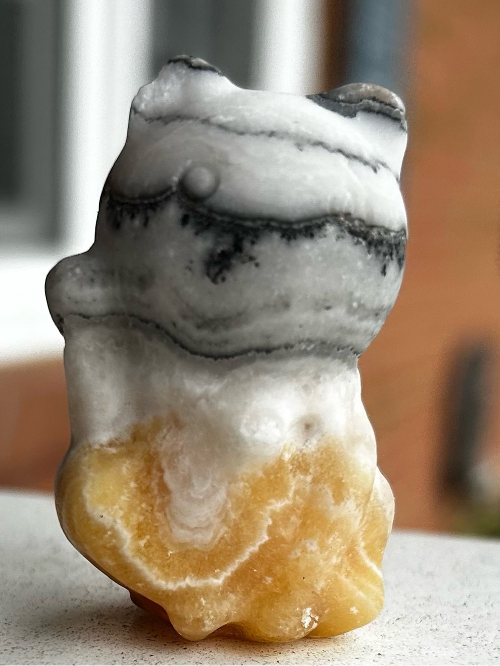 Hand-Carved Yellow and White Stone Accent Figurine